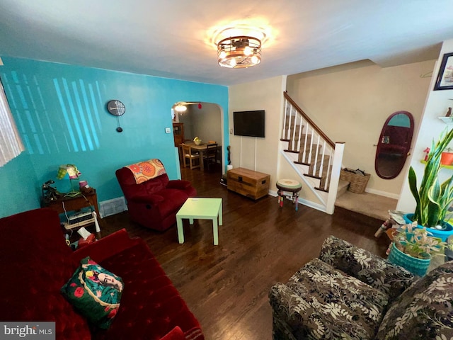 living room featuring dark hardwood / wood-style flooring