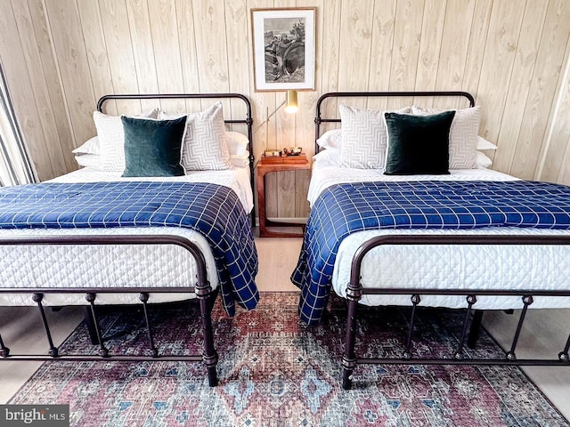 bedroom with wooden walls