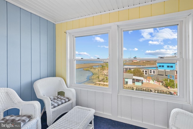 sunroom with a water view