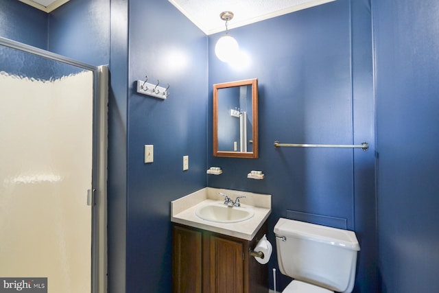 bathroom with vanity, a textured ceiling, toilet, and an enclosed shower