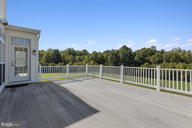 wooden deck with a lawn