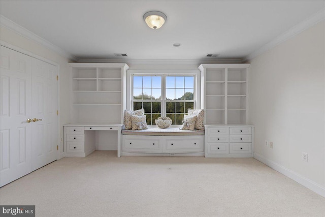 unfurnished bedroom with light colored carpet and crown molding