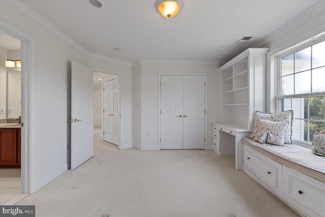 interior space featuring light carpet, ornamental molding, and sink