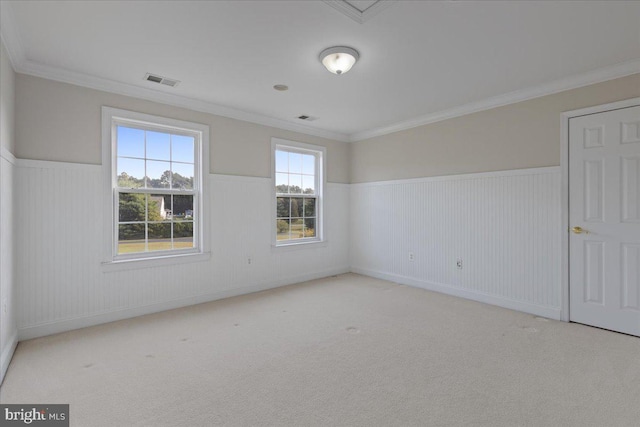 empty room with light colored carpet and ornamental molding