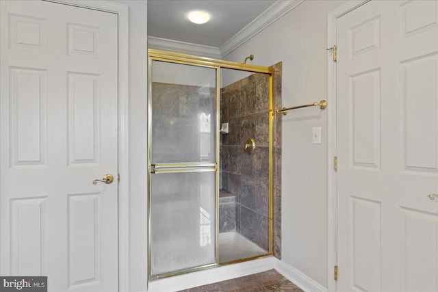 bathroom with walk in shower and crown molding