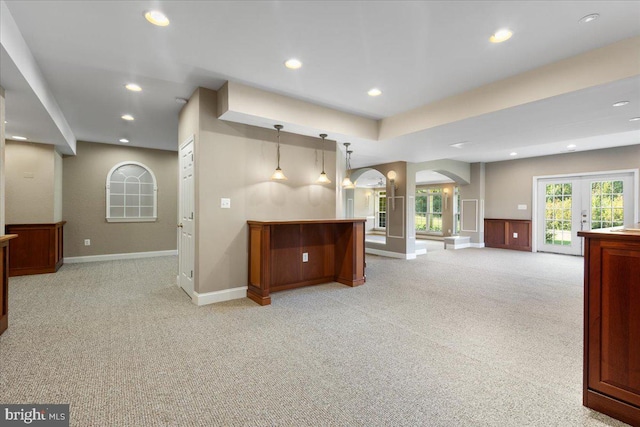 carpeted living room with french doors