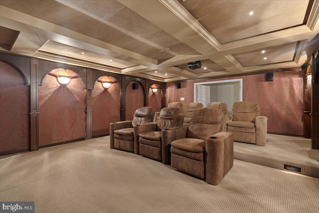 carpeted cinema room with beamed ceiling, wood walls, coffered ceiling, and ornamental molding