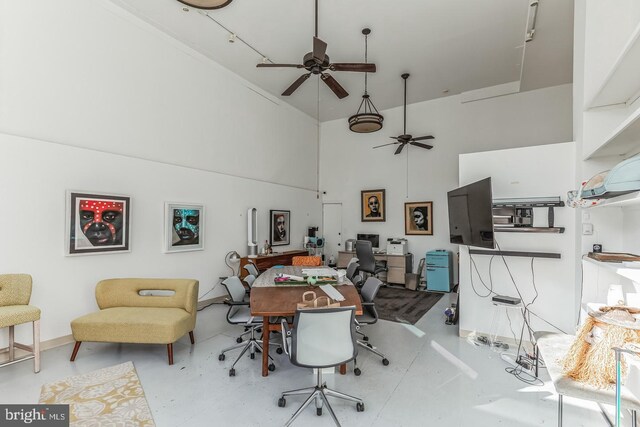 office area featuring a high ceiling and ceiling fan