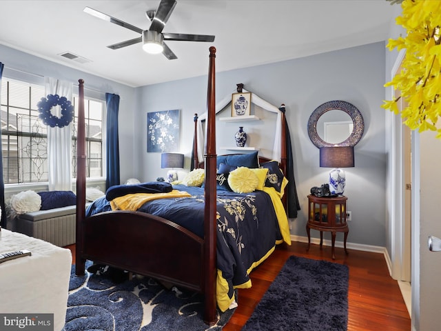 bedroom with ceiling fan and dark hardwood / wood-style floors