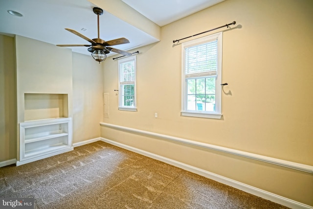 interior space with carpet floors and ceiling fan