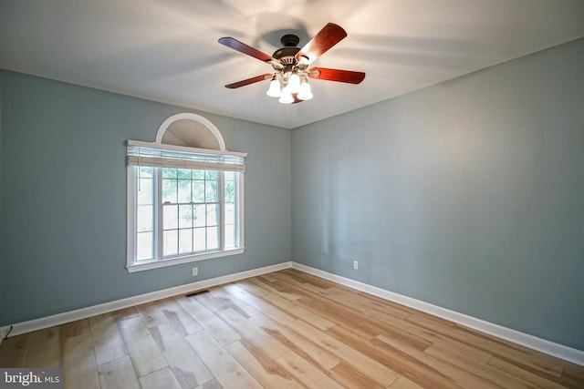 empty room featuring ceiling fan and light hardwood / wood-style flooring