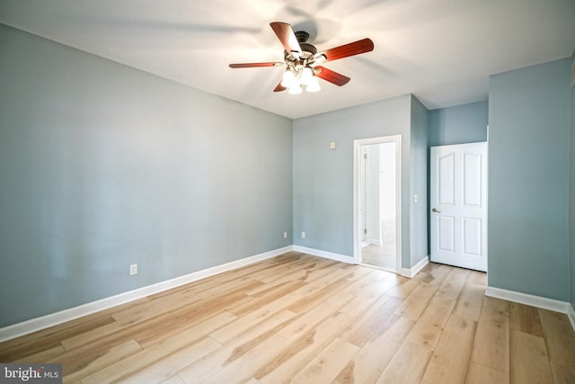 unfurnished room featuring light hardwood / wood-style flooring and ceiling fan