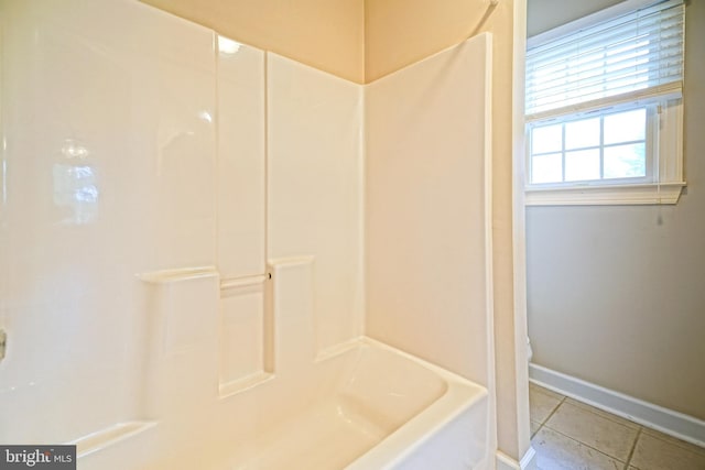 bathroom featuring shower / bathing tub combination and tile patterned floors