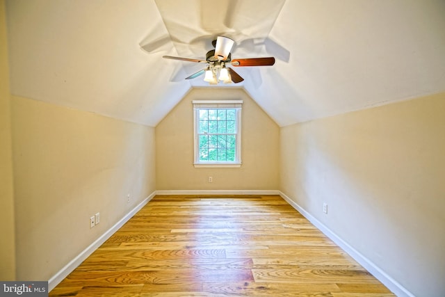 additional living space featuring lofted ceiling, light hardwood / wood-style floors, and ceiling fan