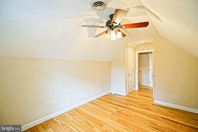 additional living space featuring light wood-type flooring, vaulted ceiling, and ceiling fan