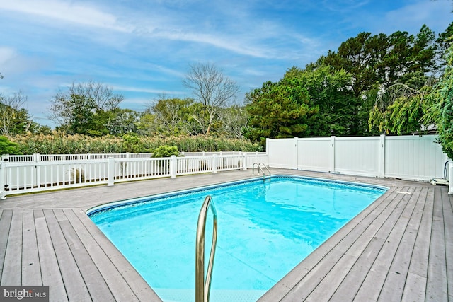 view of pool featuring a wooden deck