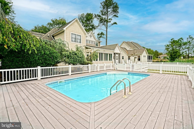 view of pool with a wooden deck