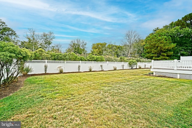 view of yard with a wooden deck