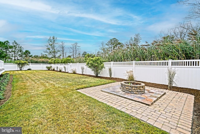 view of yard featuring a fire pit and a patio area