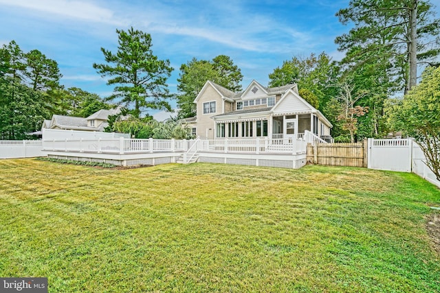 back of house featuring a yard