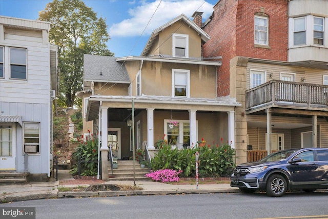 townhome / multi-family property with covered porch