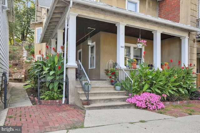 doorway to property with a porch