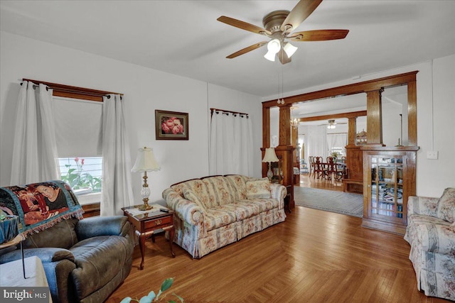 living room featuring parquet flooring and ceiling fan