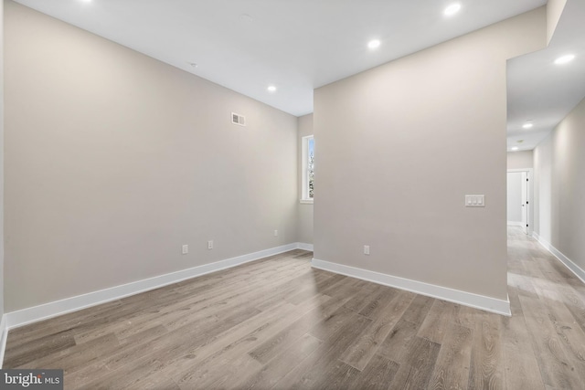 unfurnished room featuring light hardwood / wood-style floors