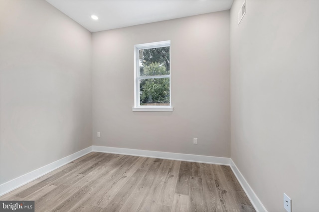 unfurnished room featuring light hardwood / wood-style flooring