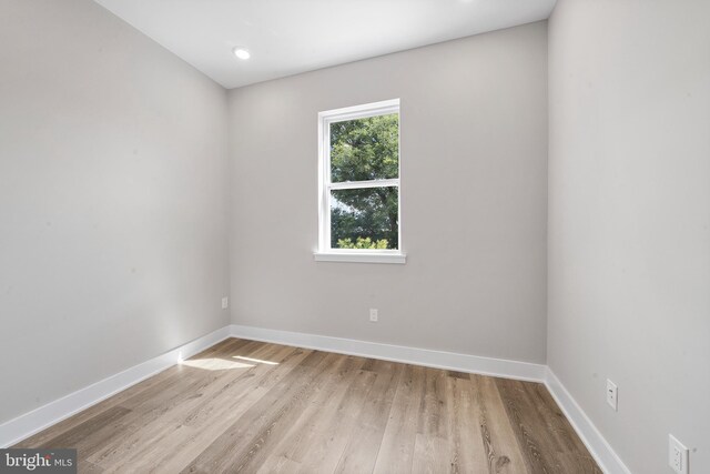 unfurnished room featuring light hardwood / wood-style flooring