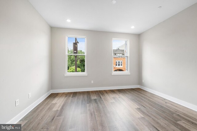 spare room featuring light wood-type flooring