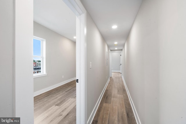 corridor with light wood-type flooring