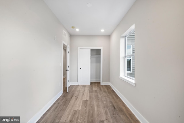 hallway featuring light wood-type flooring