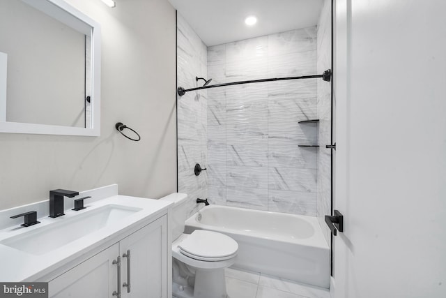 full bathroom with vanity, tile patterned floors, tiled shower / bath, and toilet