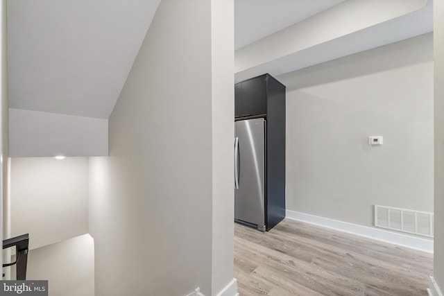 corridor featuring light hardwood / wood-style floors