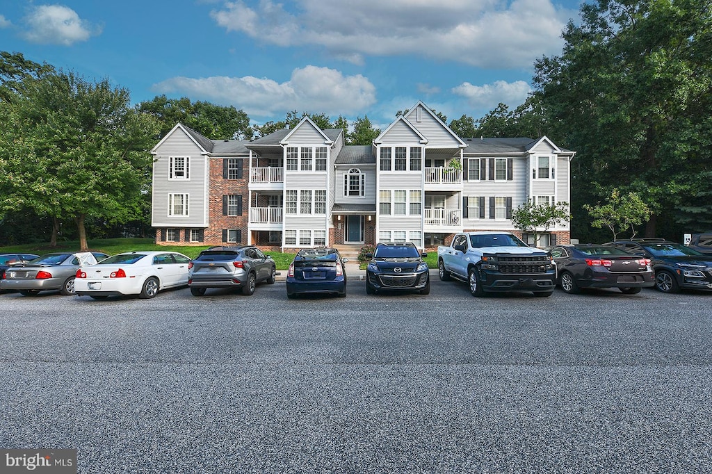 view of front of property with a balcony