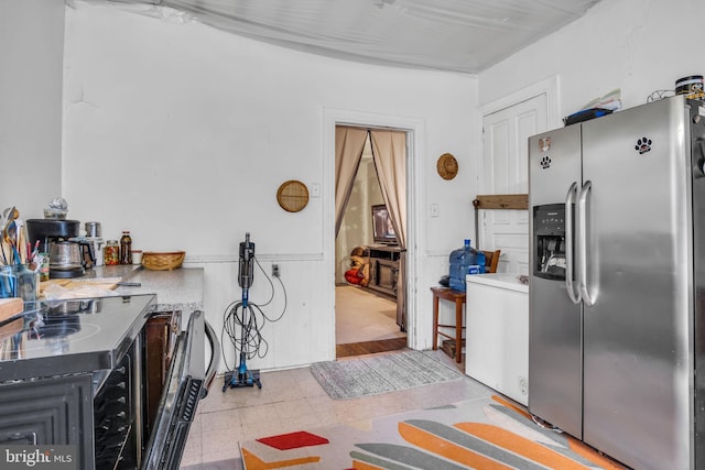 kitchen with stainless steel refrigerator with ice dispenser