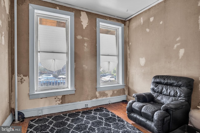 sitting room featuring ornamental molding and hardwood / wood-style floors