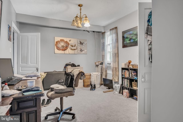 carpeted home office with an inviting chandelier