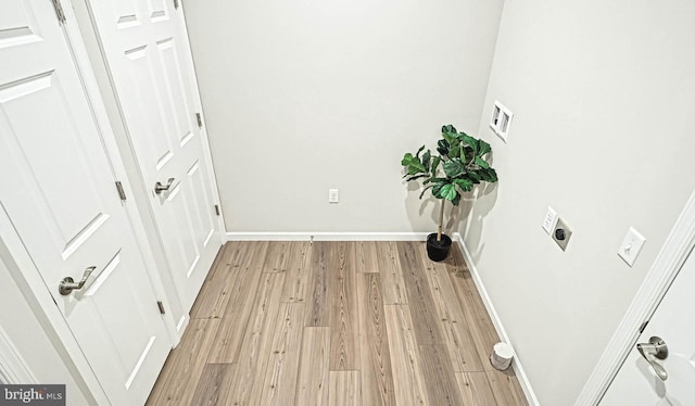 corridor featuring light wood-type flooring