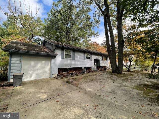 exterior space featuring a garage and driveway