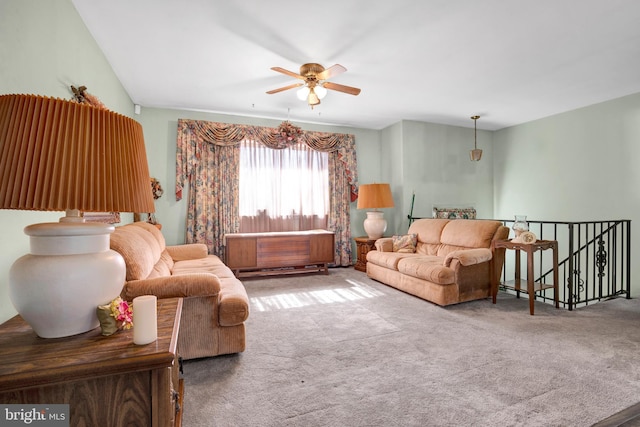 living area featuring carpet floors and a ceiling fan