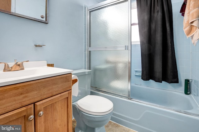 bathroom featuring shower / bath combination with glass door, vanity, and toilet