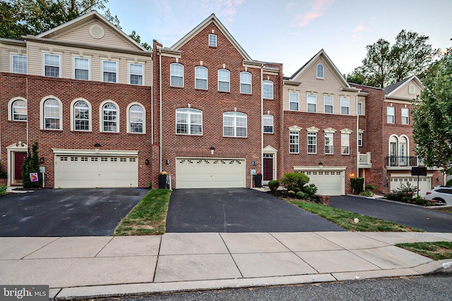 multi unit property featuring a garage