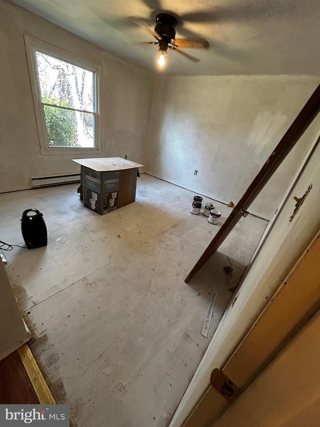 interior space featuring a baseboard heating unit and ceiling fan