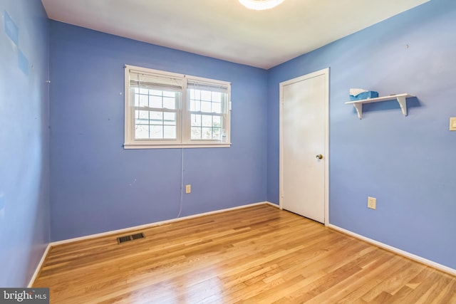 empty room with light hardwood / wood-style floors