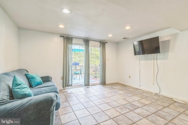 living room with light tile patterned floors