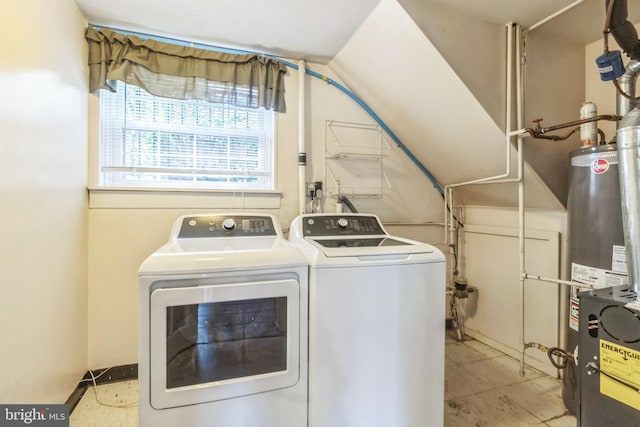 washroom with separate washer and dryer and gas water heater