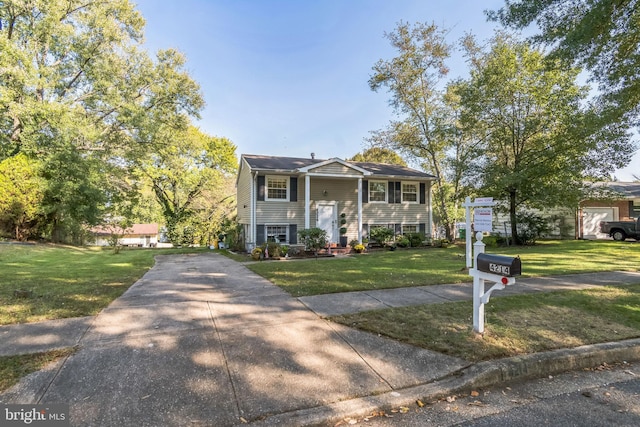 bi-level home with a front yard