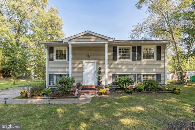 raised ranch featuring a front yard